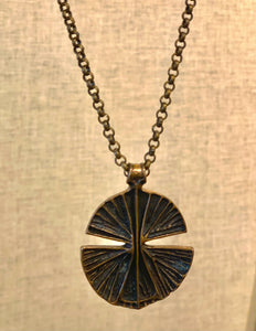 Bronze abstract lily pad pendant by Unn Tangerud